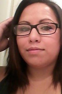 voluptuous stunner seductively posing in black lingerie