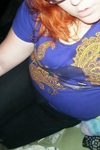 plus-size damsel posing seductively in lingerie touching her figure erotically